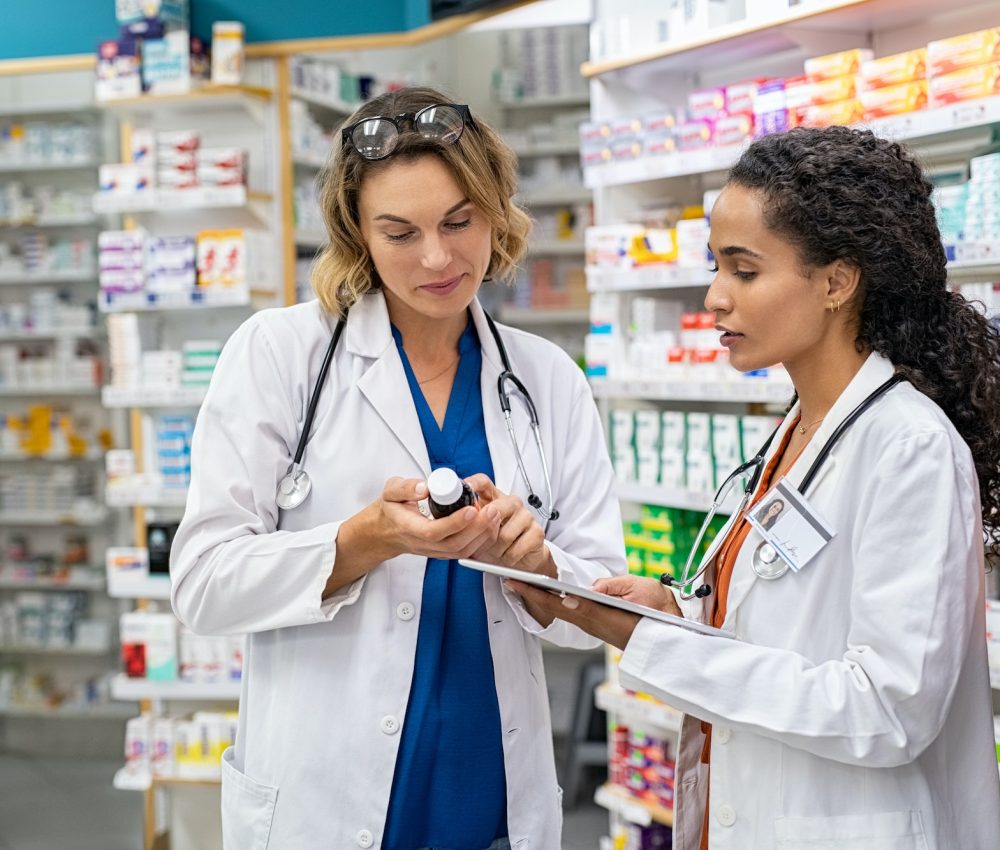 two-pharmacists-working-together-at-pharmacy-1